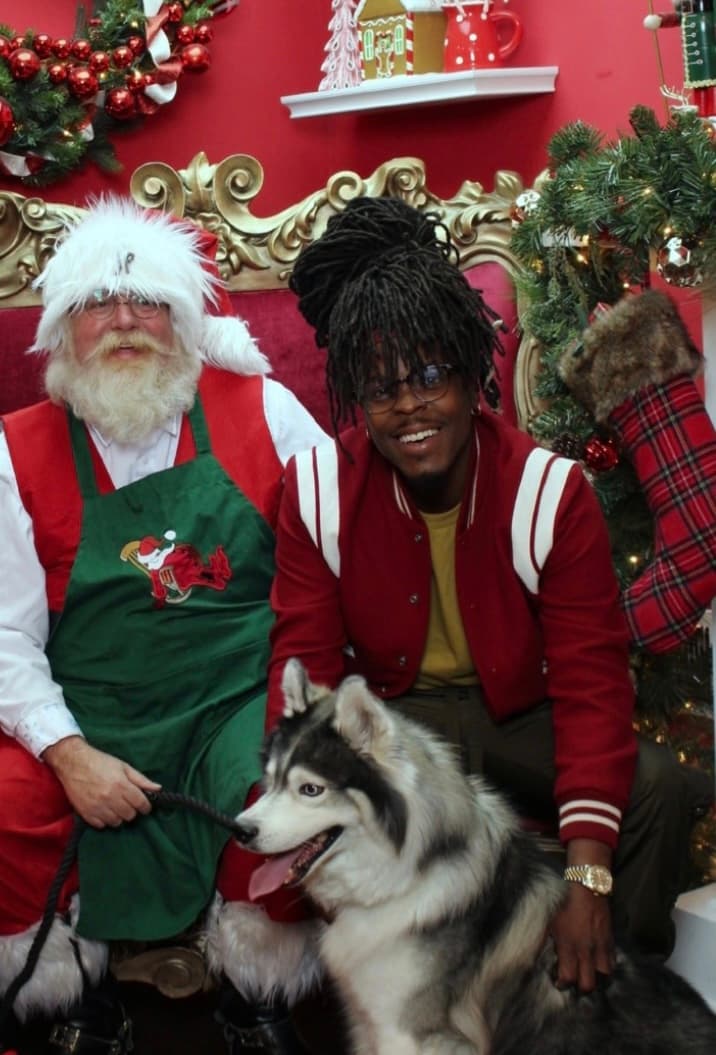 Kemar, founder of K-911, with his Siberian Husky